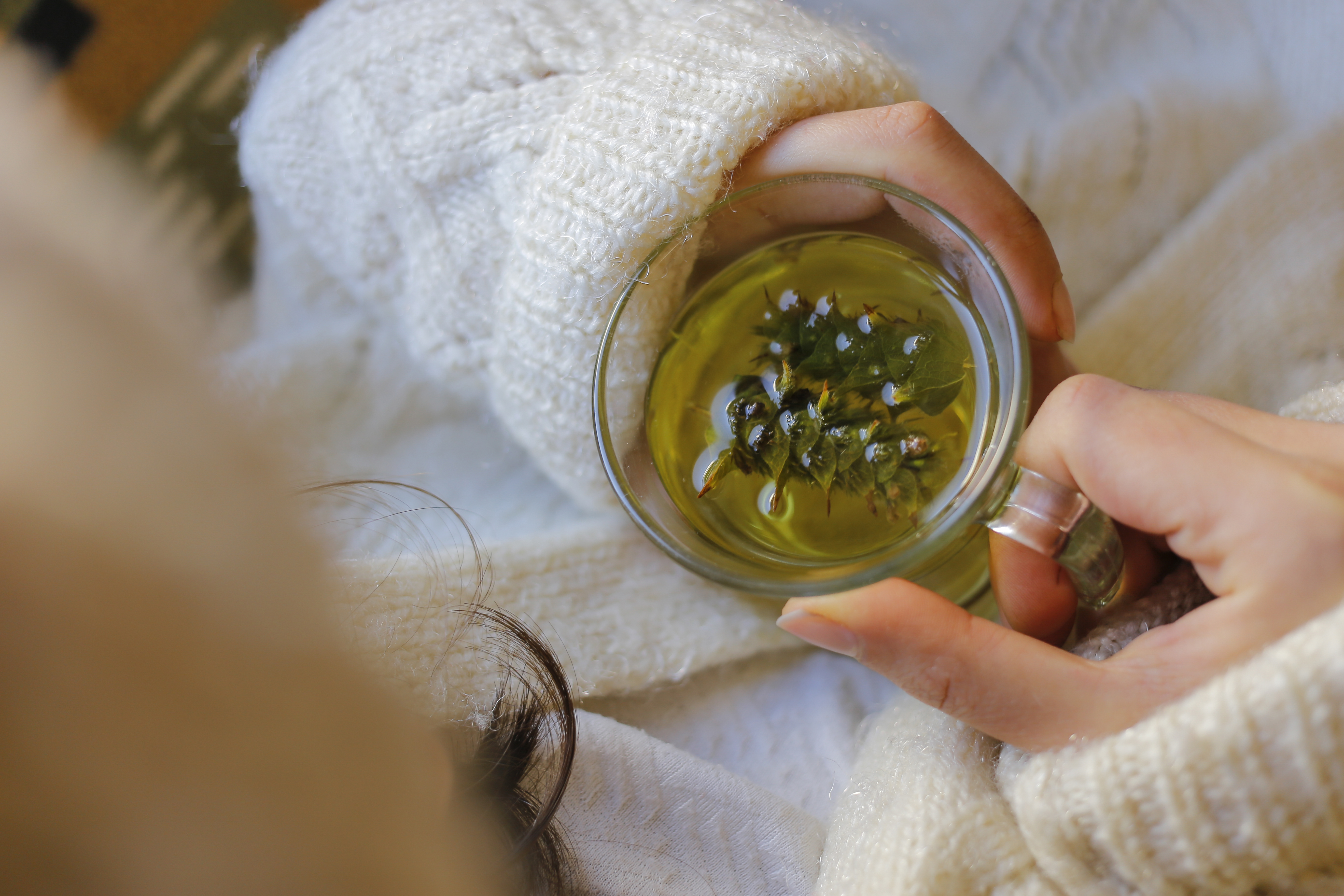 Sage tea with woman hand