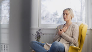 Woman meditating at home